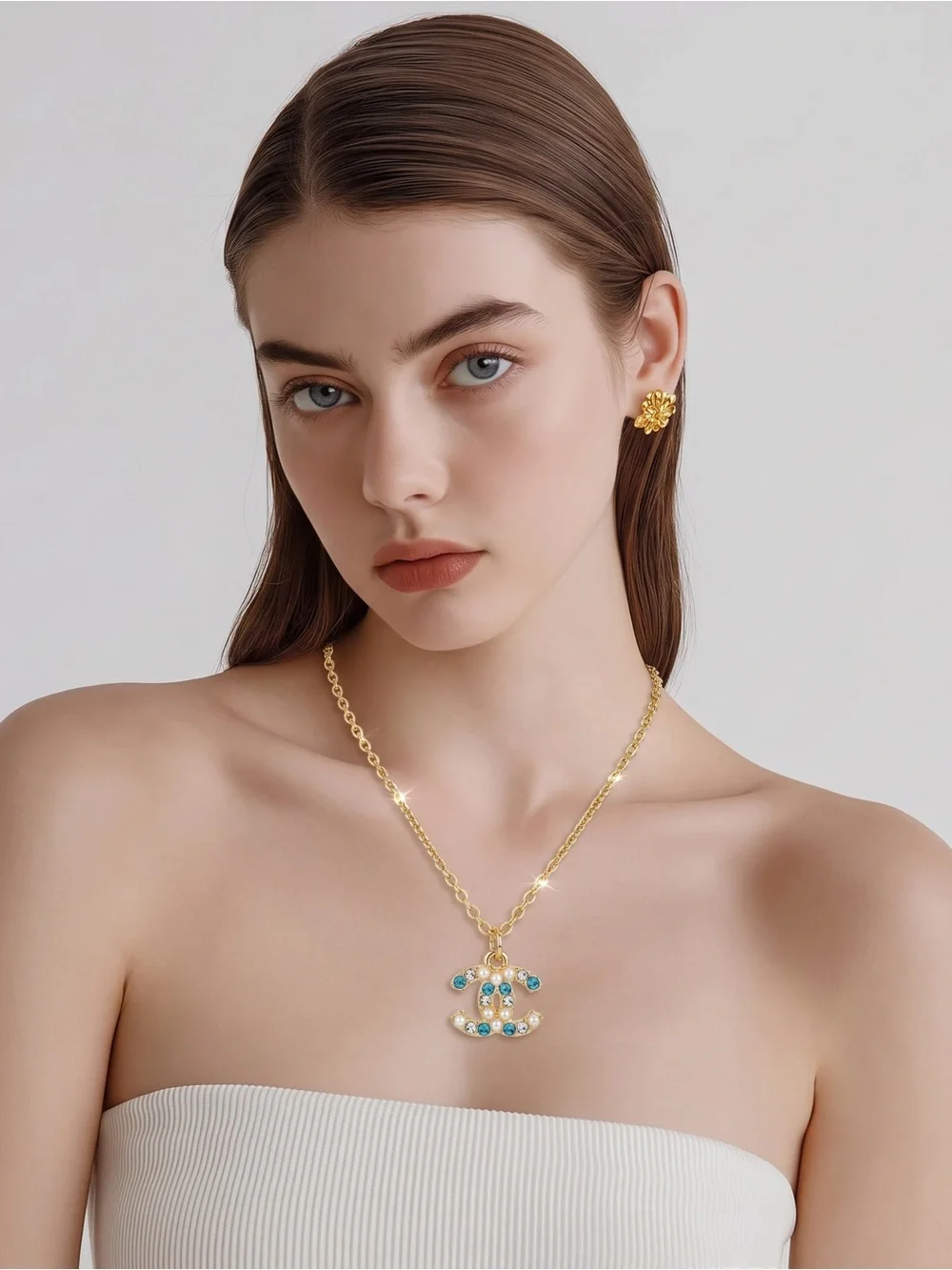 Gold Chain Necklace with Blue and Clear Gemstone Pendant